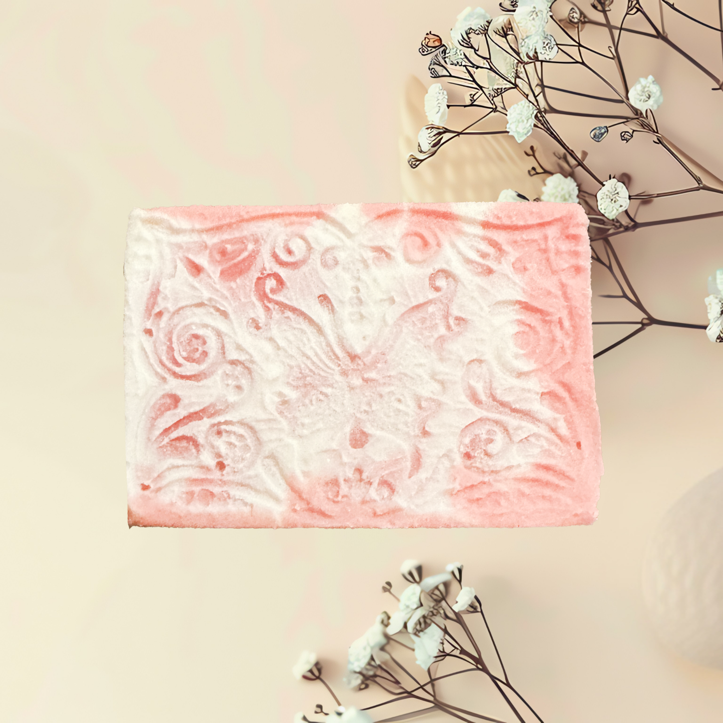 Bar of soap with decorative pattern on a light background with flowers