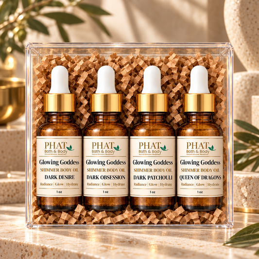 Dark Collection Glowing Goddess Shimmer Oil sampler featuring Dark Desire, Dark Obsession, Dark Patchouli, and Queen of Dragons. Four 1 oz golden shimmer body oils with deep, warm, earthy, and mysterious fragrances in amber glass dropper bottles.