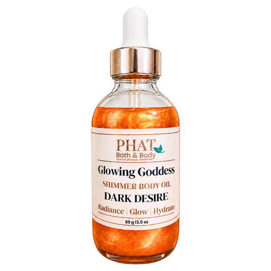 Phat Bath & Body Glowing Goddess Shimmer Body Oil in Dark Desire, 3.5 oz glass dropper bottle with warm orange-gold shimmer.