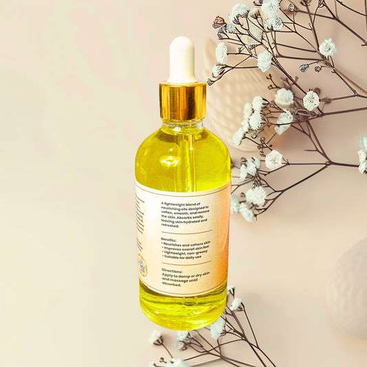 Bottle of yellow liquid with dropper on a beige background with white flowers