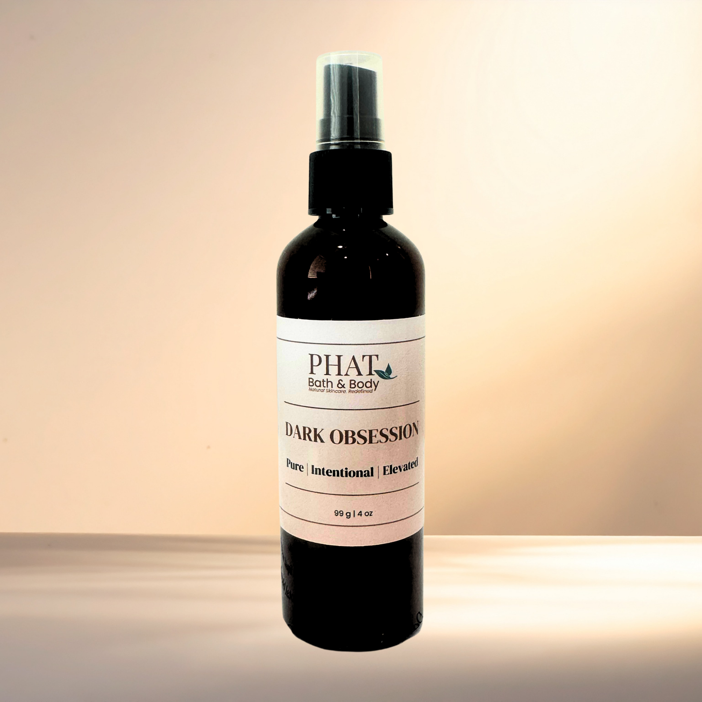 Bottle of 'Dark Obsession' by PHAT Bath & Body on a gradient background