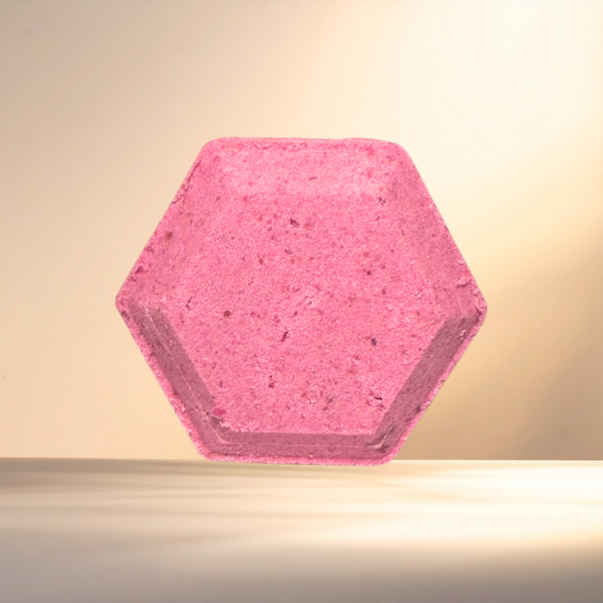 Hexagonal pink steamer on a neutral background