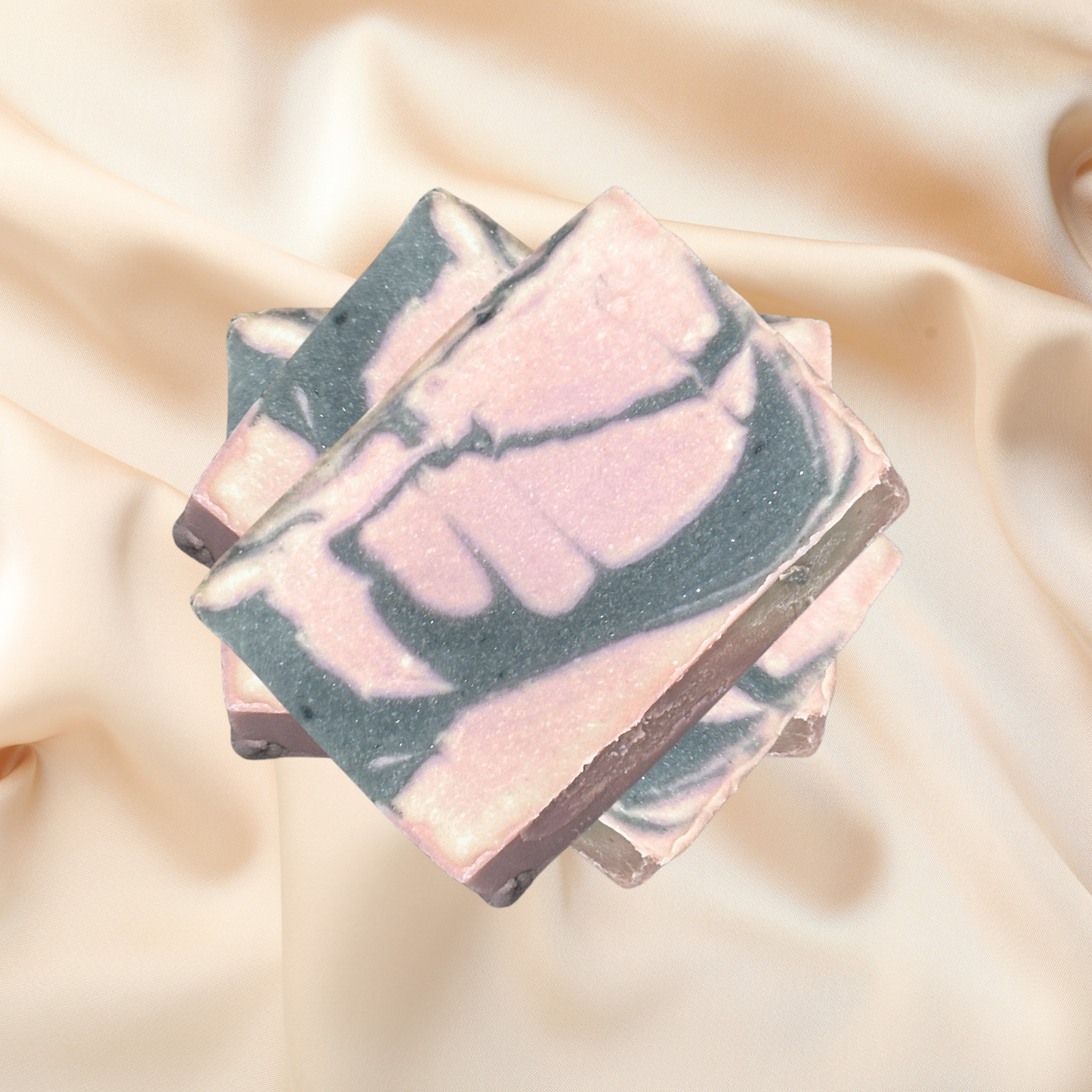 Marbled soap bar on a soft beige fabric background