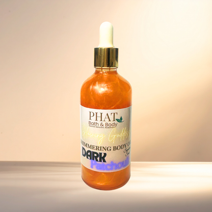 Bottle of PHAT Bath & Body shimmering body oil on a gradient background