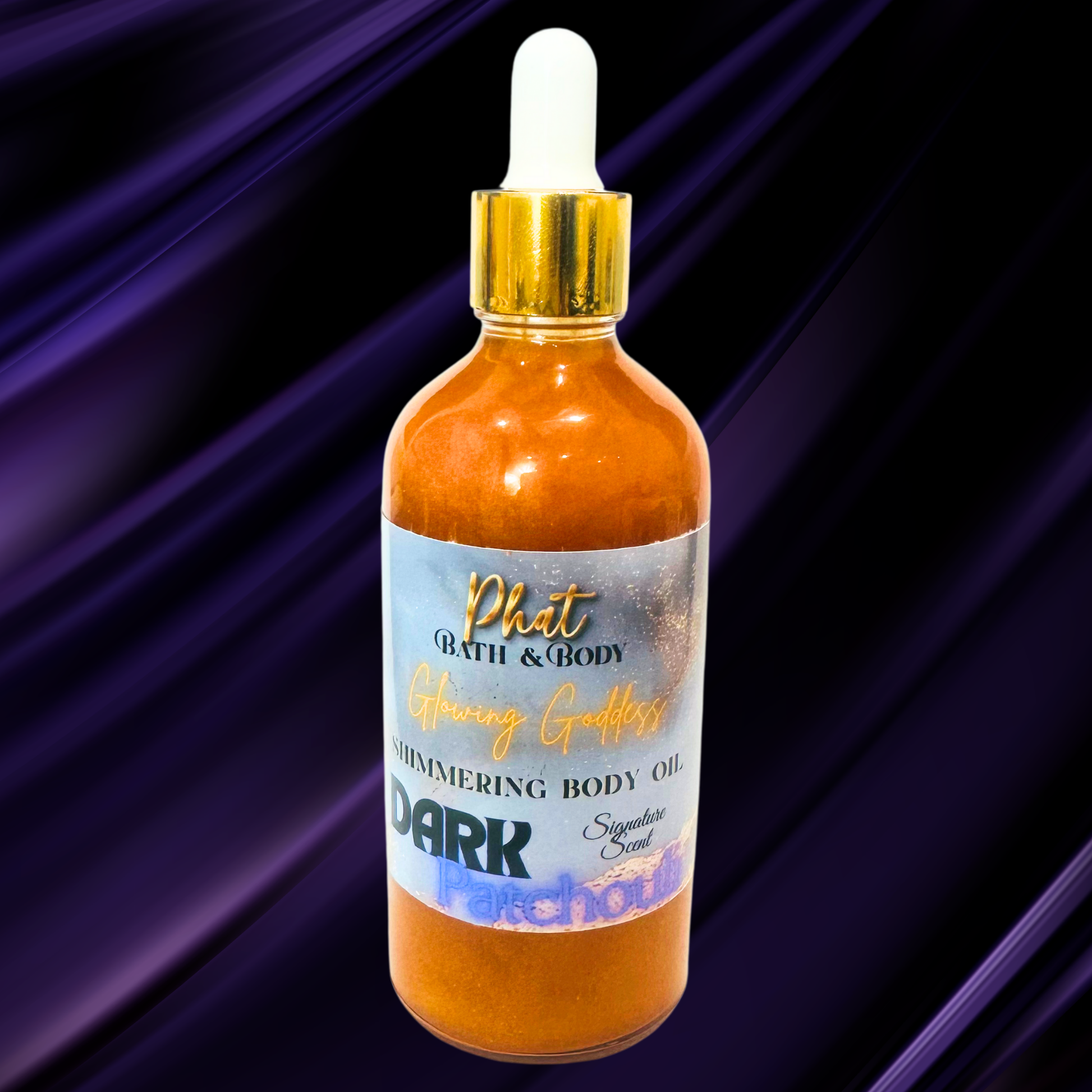 Bottle of Phat Bath & Body shimmering body oil with a gold dropper on a purple background