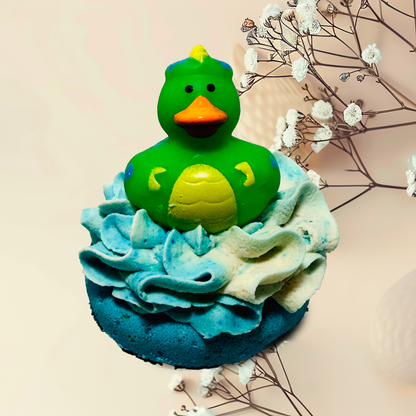 Green rubber duck on a blue bubble bomb with decorative elements.