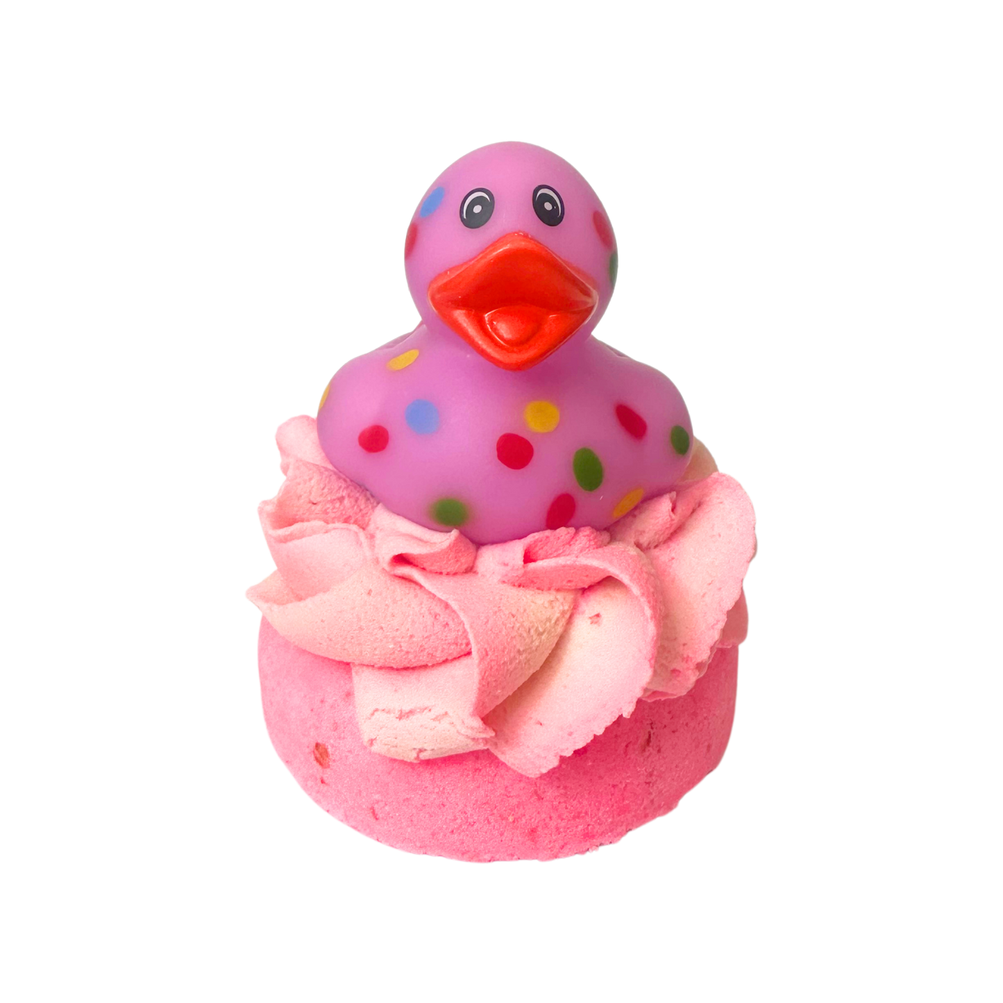 Pink rubber duck with polka dots on top of a pink bath bomb with frosting.