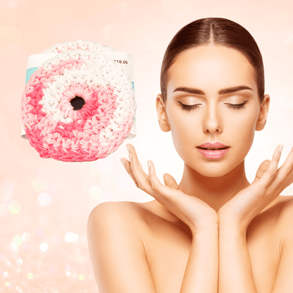 Woman holding a pink crochet scrubby against a beige background