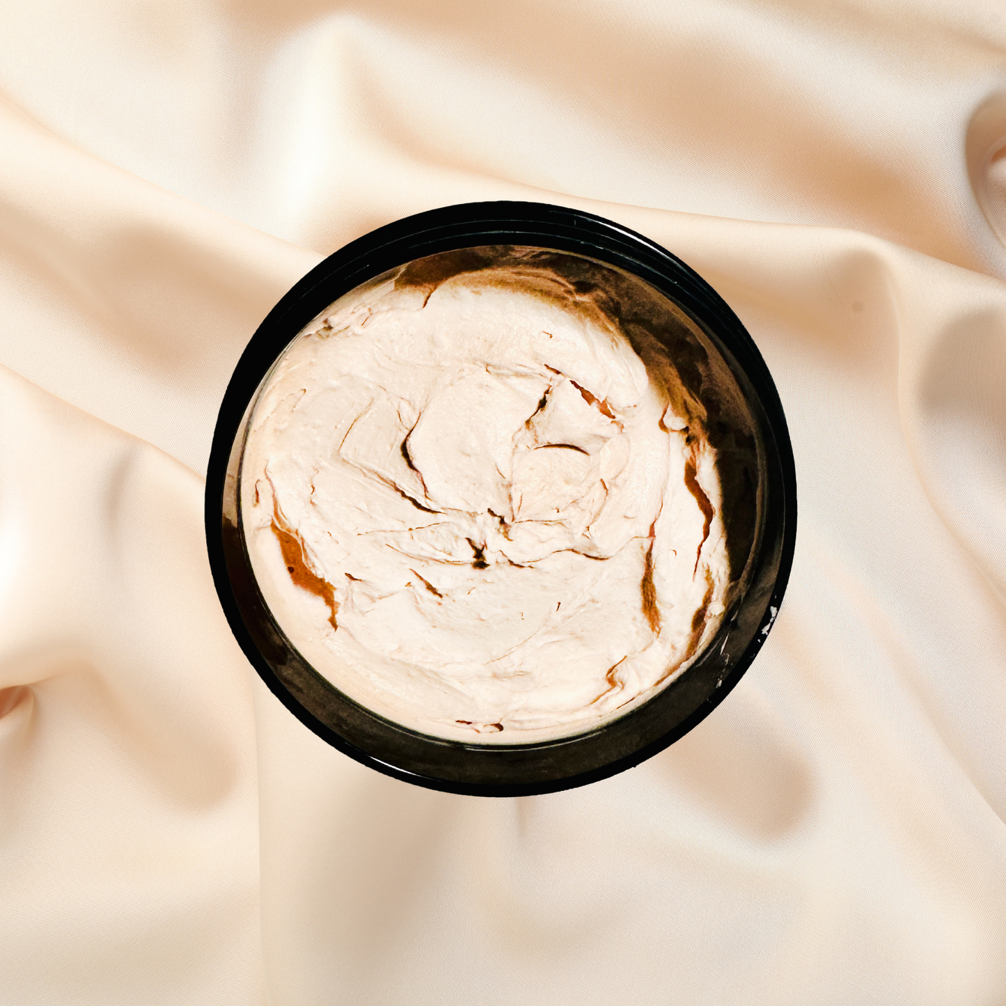 Jar of clay mask on a soft fabric background