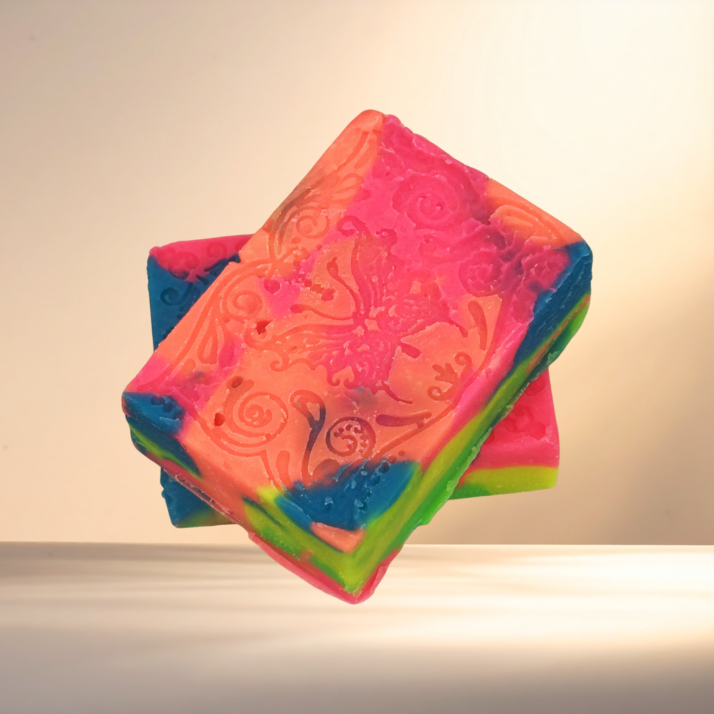Colorful soap with embossed design on a neutral background