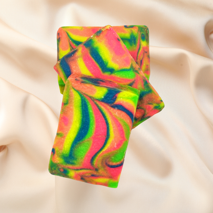 Colorful swirled soap bar on a beige fabric background
