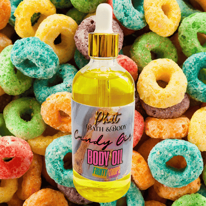 Bottle of Phat Bath & Body Candy Girl Body Oil surrounded by colorful fruit loops cereal.