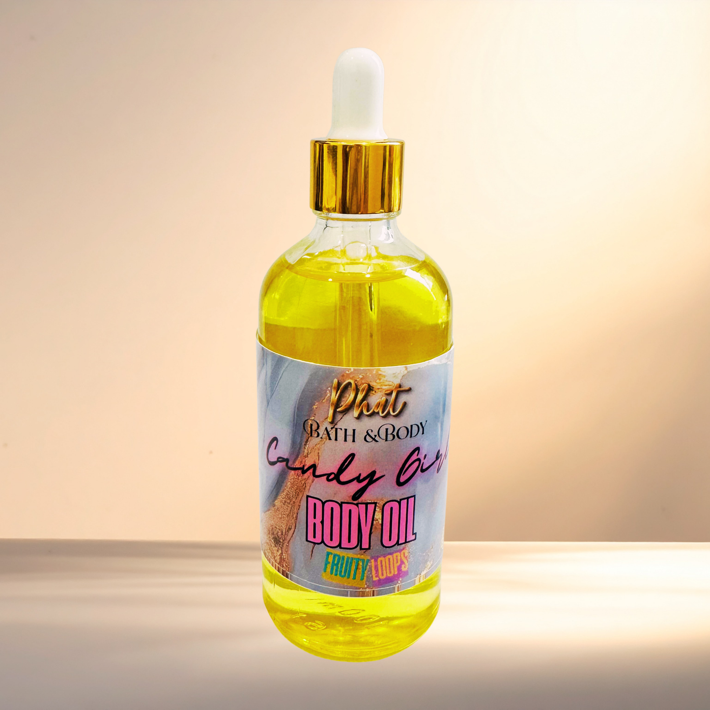 Bottle of body oil with a colorful label on a gradient background