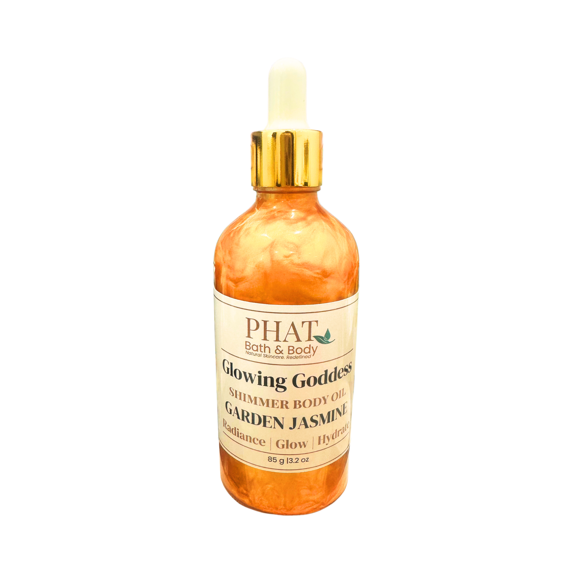 Bottle of 'Glowing Goddess' shimmer body oil by Phat Bath & Body on a white background
