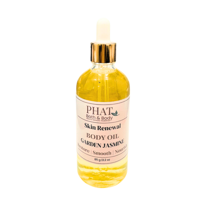 Bottle of Phat Bath & Body Skin Renewal Body Oil with Garden Jasmine fragrance on a white background
