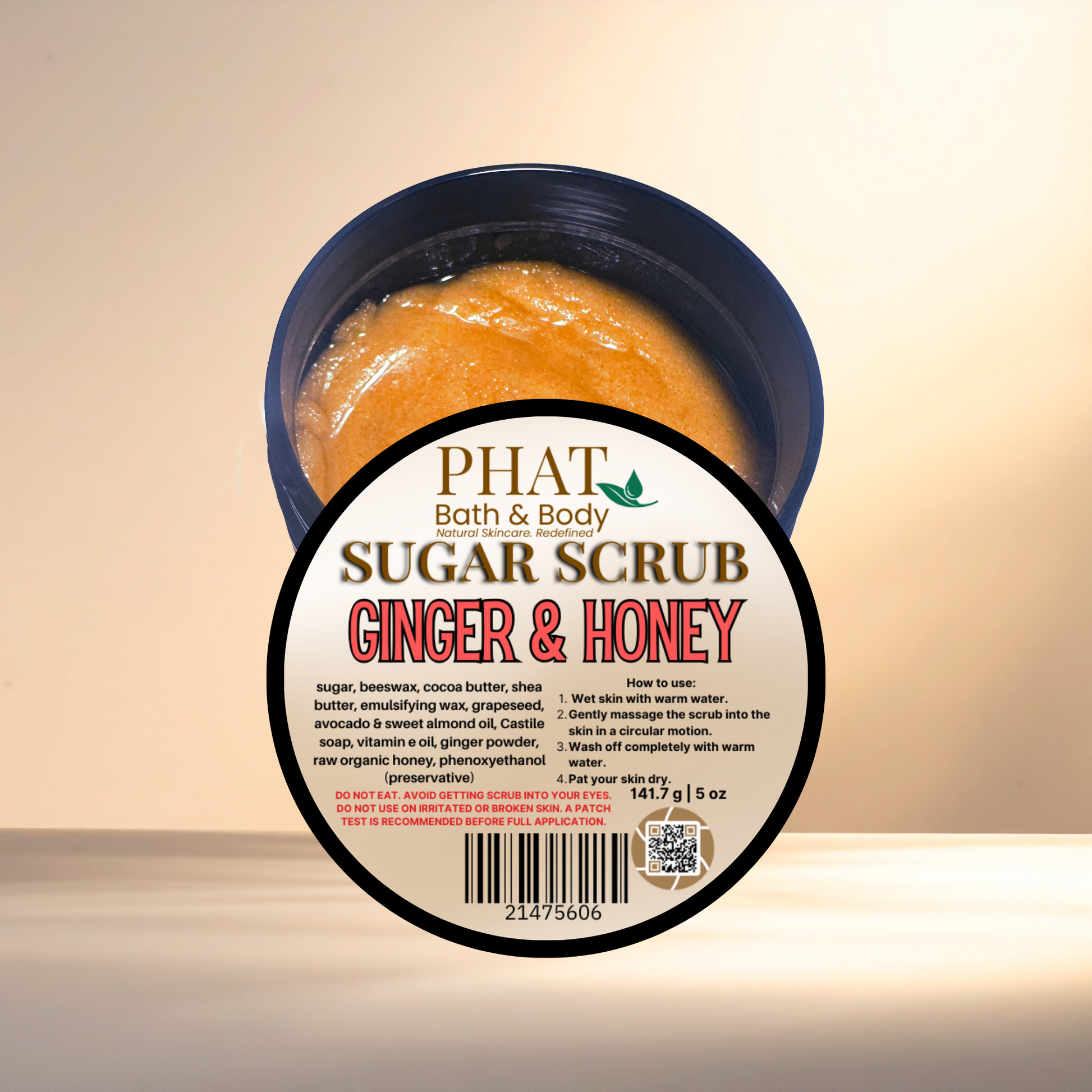 Ginger & Honey sugar scrub container with 'Phat Bath & Body' label on a beige background