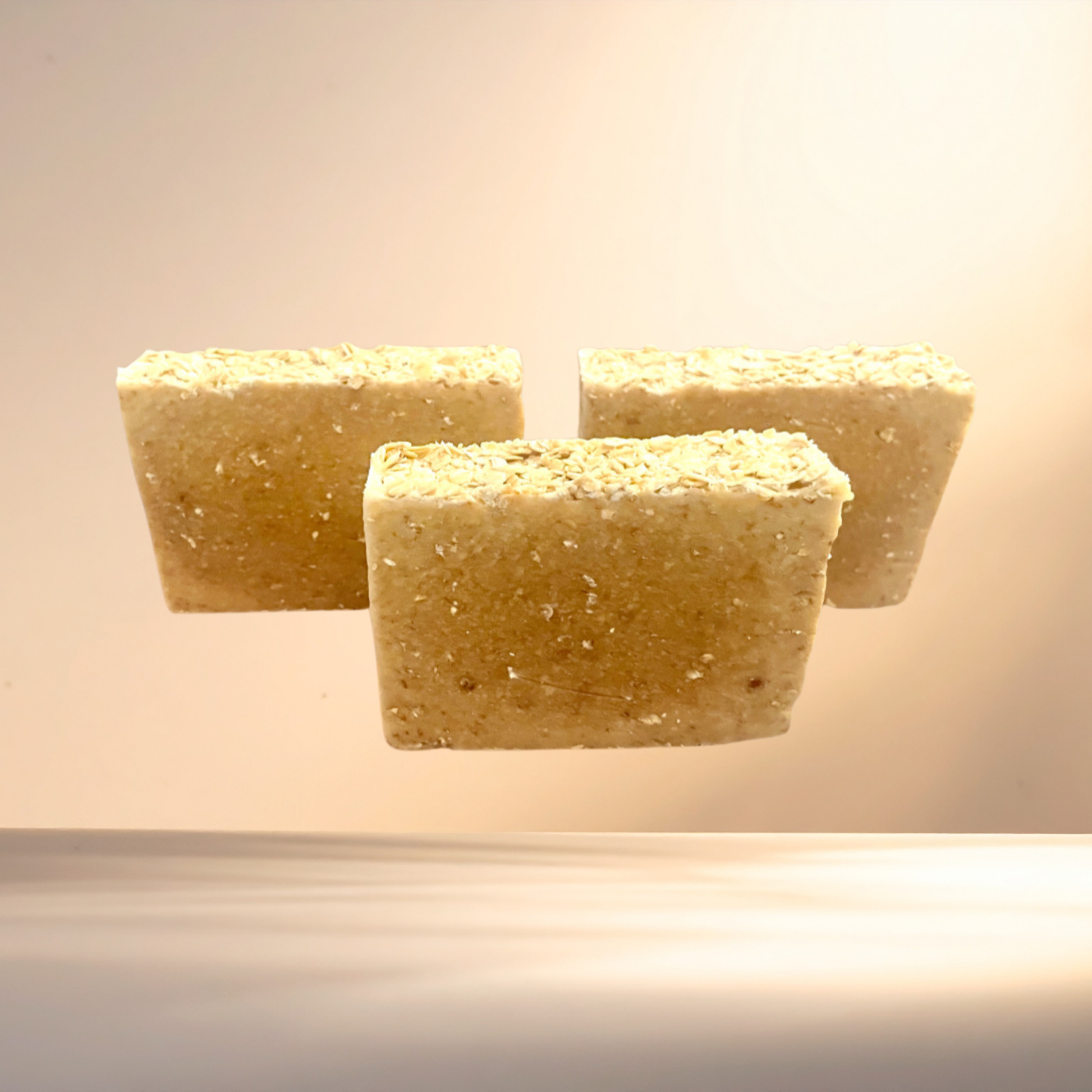 Three rectangular soap bars on a light background