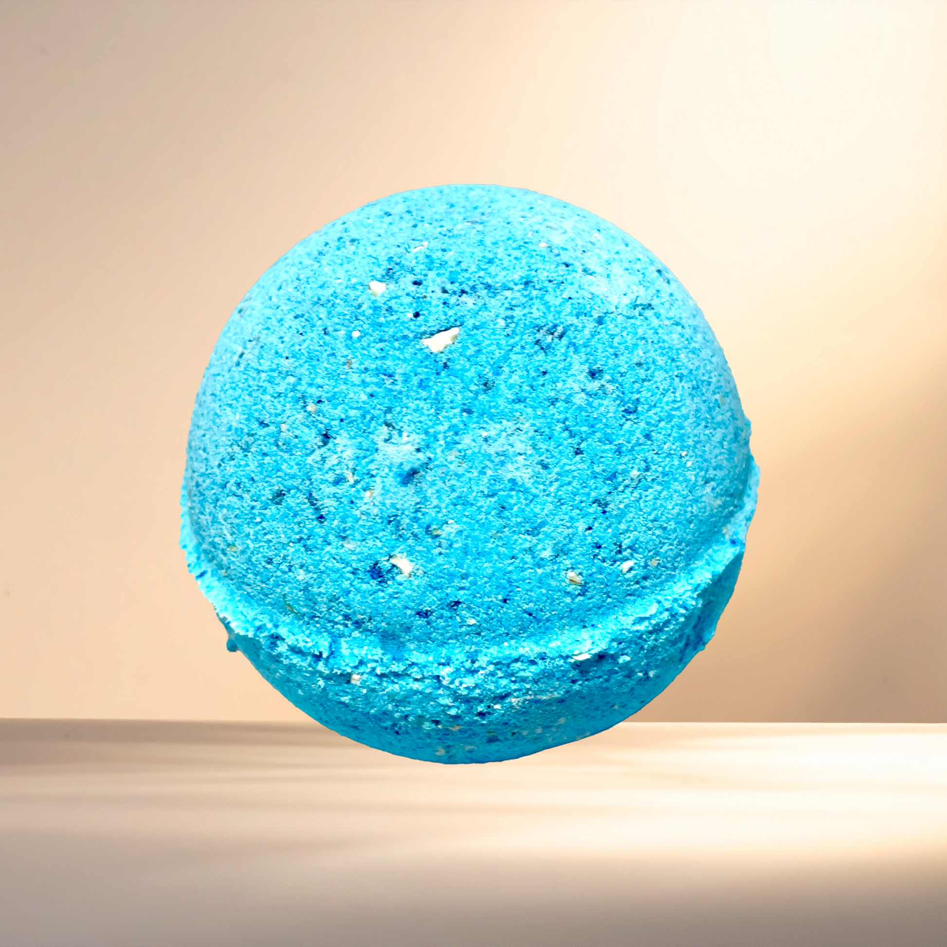 Blue bath bomb on a beige background