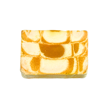 Marbled soap bar with orange and white pattern on a white background