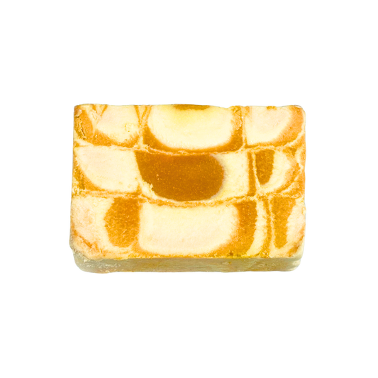 Marbled soap bar with orange and white pattern on a white background