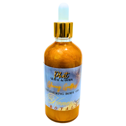 Bottle of Phat Bath & Body Shimmering Body Oil with a gold dropper on a white background