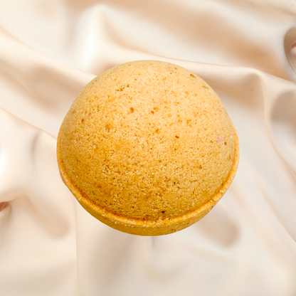 Yellow bath bomb on a beige fabric background