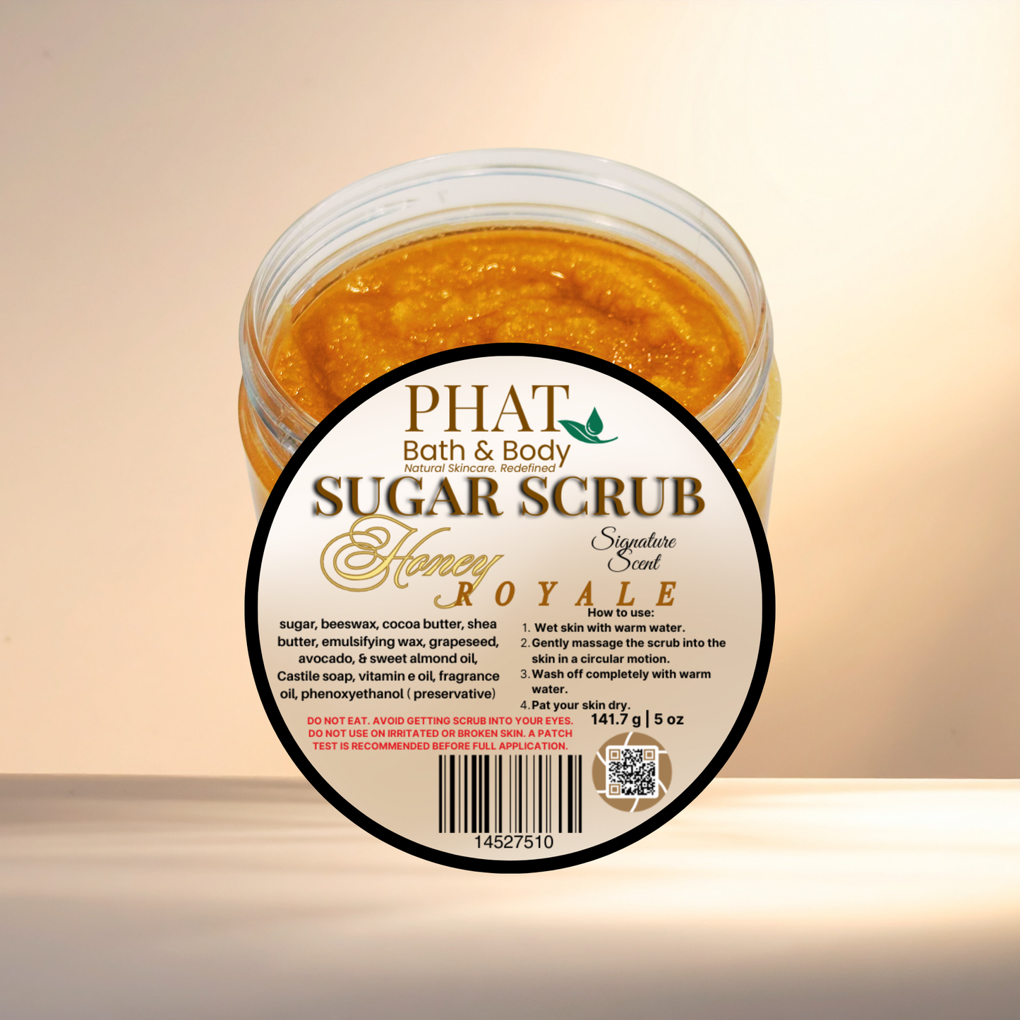 Jar of Phat Bath & Body Honey Royale Sugar Scrub on a beige background