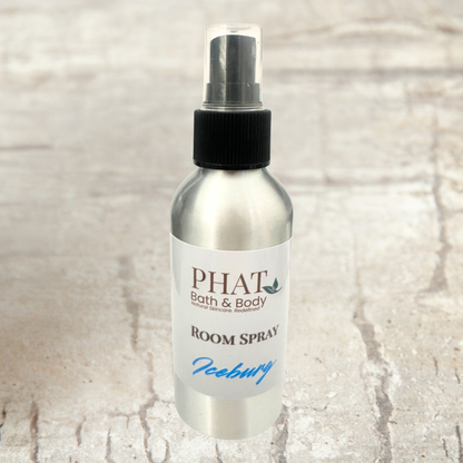 Room spray bottle labeled 'PHAT Bath & Body' on a textured beige background