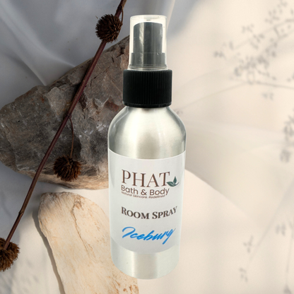 Room spray bottle labeled 'PHAT Bath & Body' on a neutral background with decorative elements.