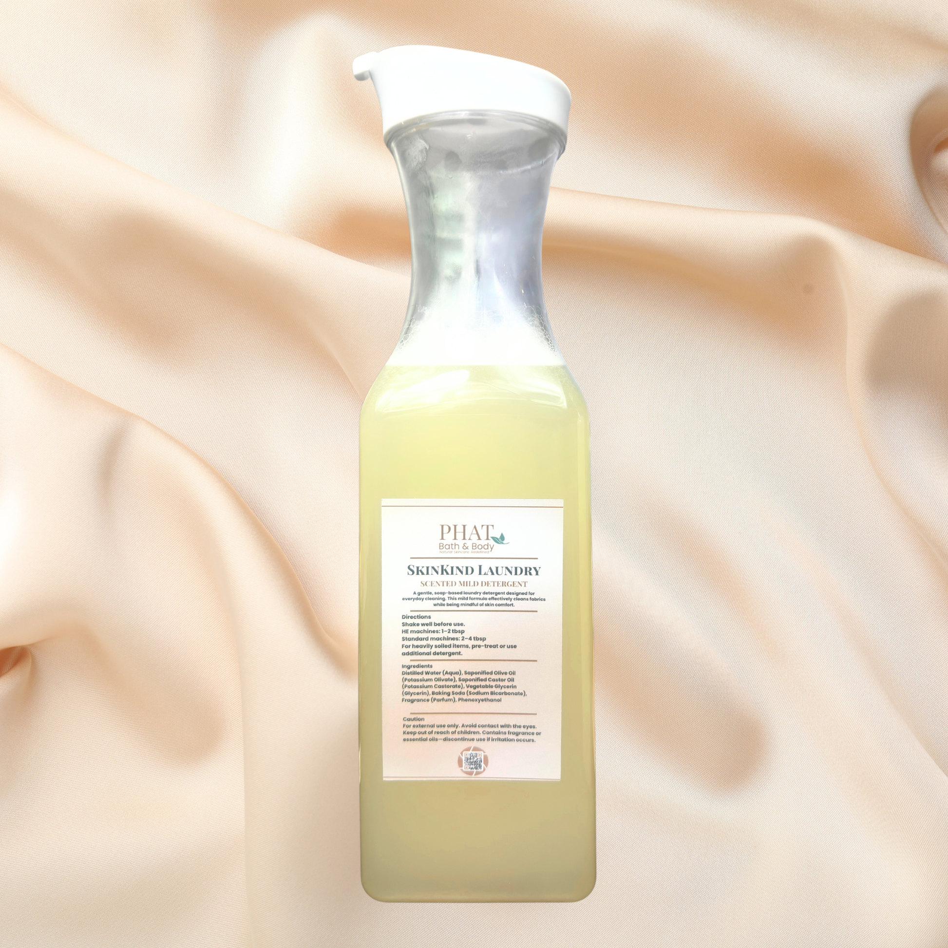 Bottle of liquid detergent on a beige fabric background