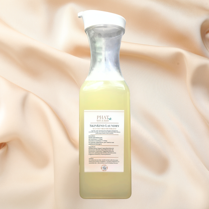 Bottle of liquid detergent on a beige fabric background