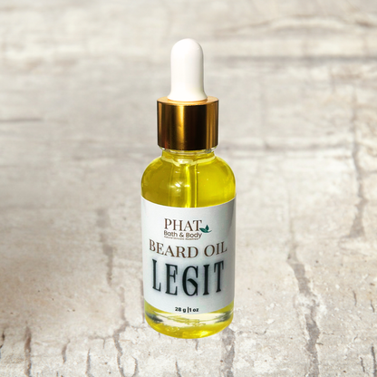 Bottle of Phat Bath & Body Beard Oil on a textured surface