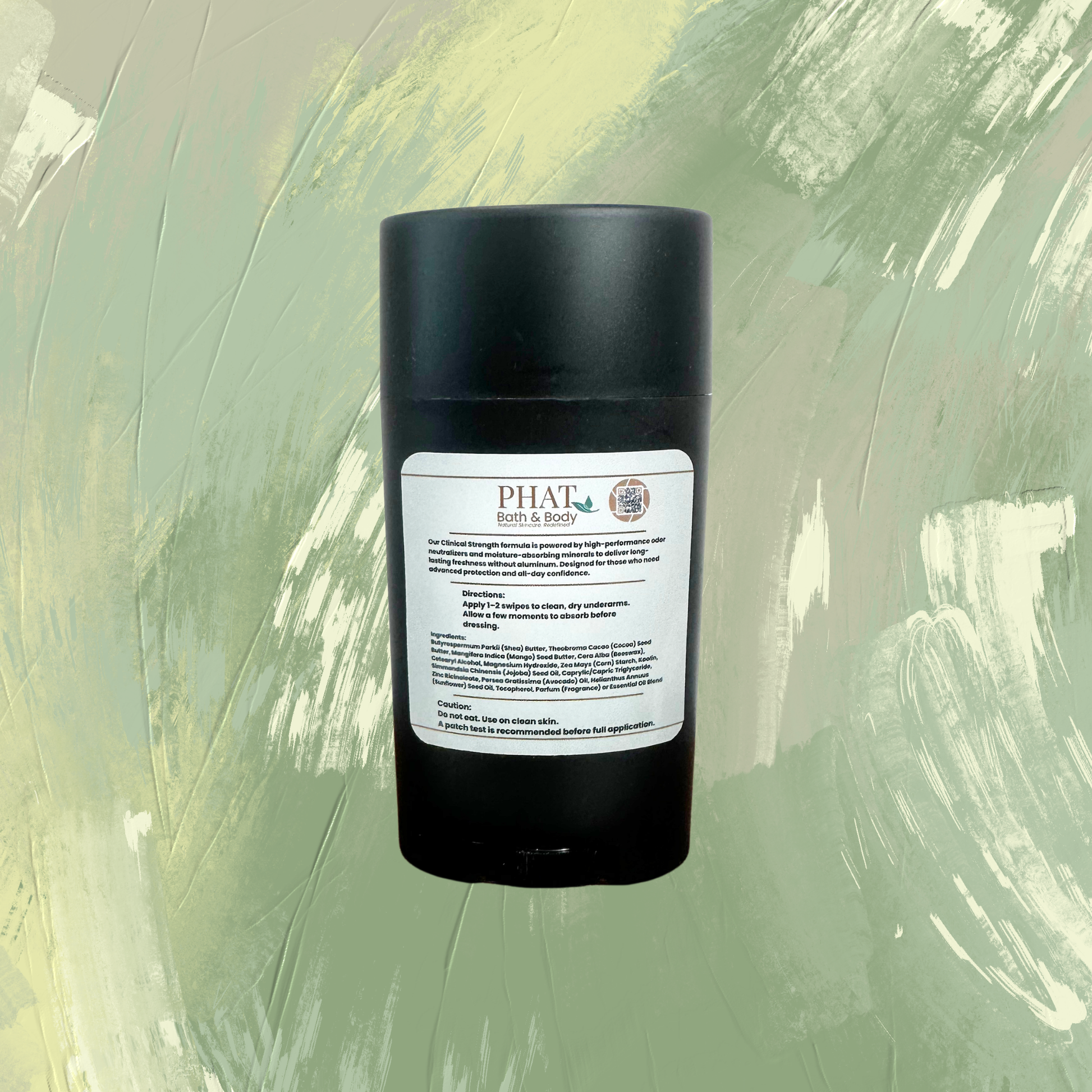 A black cylindrical deodorant stick container with a white label reading PHAT & BODY, centered against a textured sage green and cream painted background.