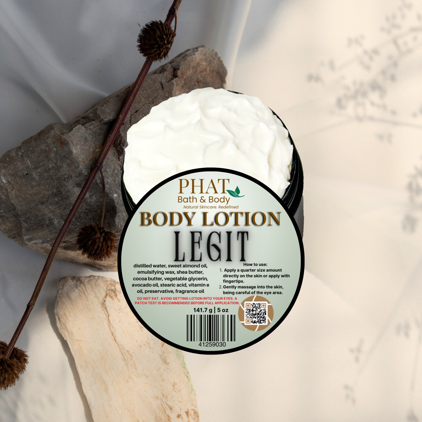 Body lotion container labeled 'PHAT Bath & Body' with natural elements on a light background