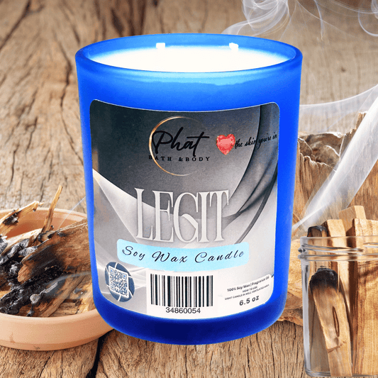 Blue candle labeled 'Legit' on a wooden surface with decorative items.