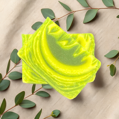 Green soap bar with leafy branches on a beige fabric background