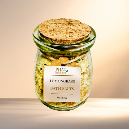 Jar of lemongrass bath salts with a cork lid on a gradient background