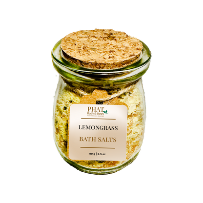 Jar of lemongrass bath salts with a cork lid on a white background