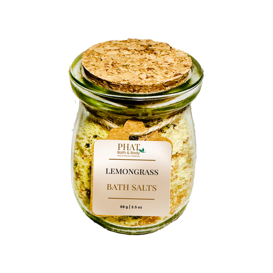 Jar of lemongrass bath salts with a cork lid on a white background