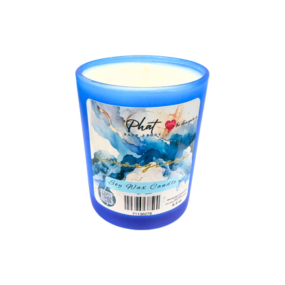 Blue candle with a label on a white background