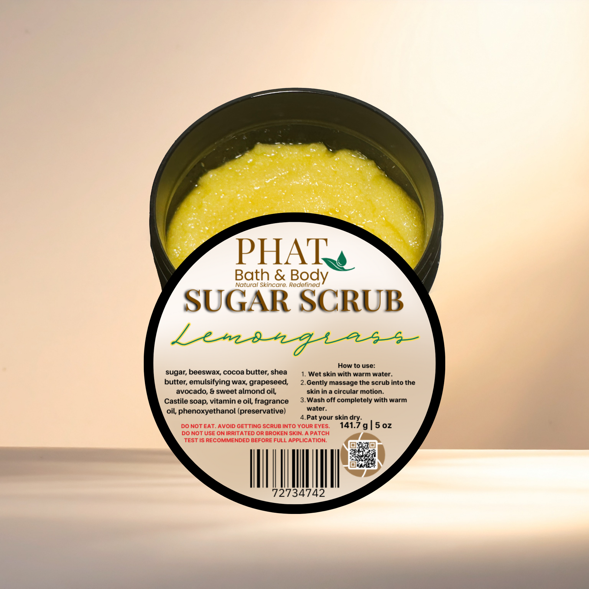 Container of Phat Bath & Body Lemongrass sugar scrub with label on a light background