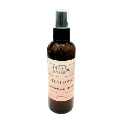 Brown spray bottle with pink label on a white background