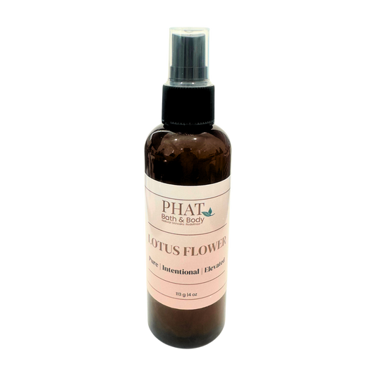 Brown spray bottle with pink label on a white background