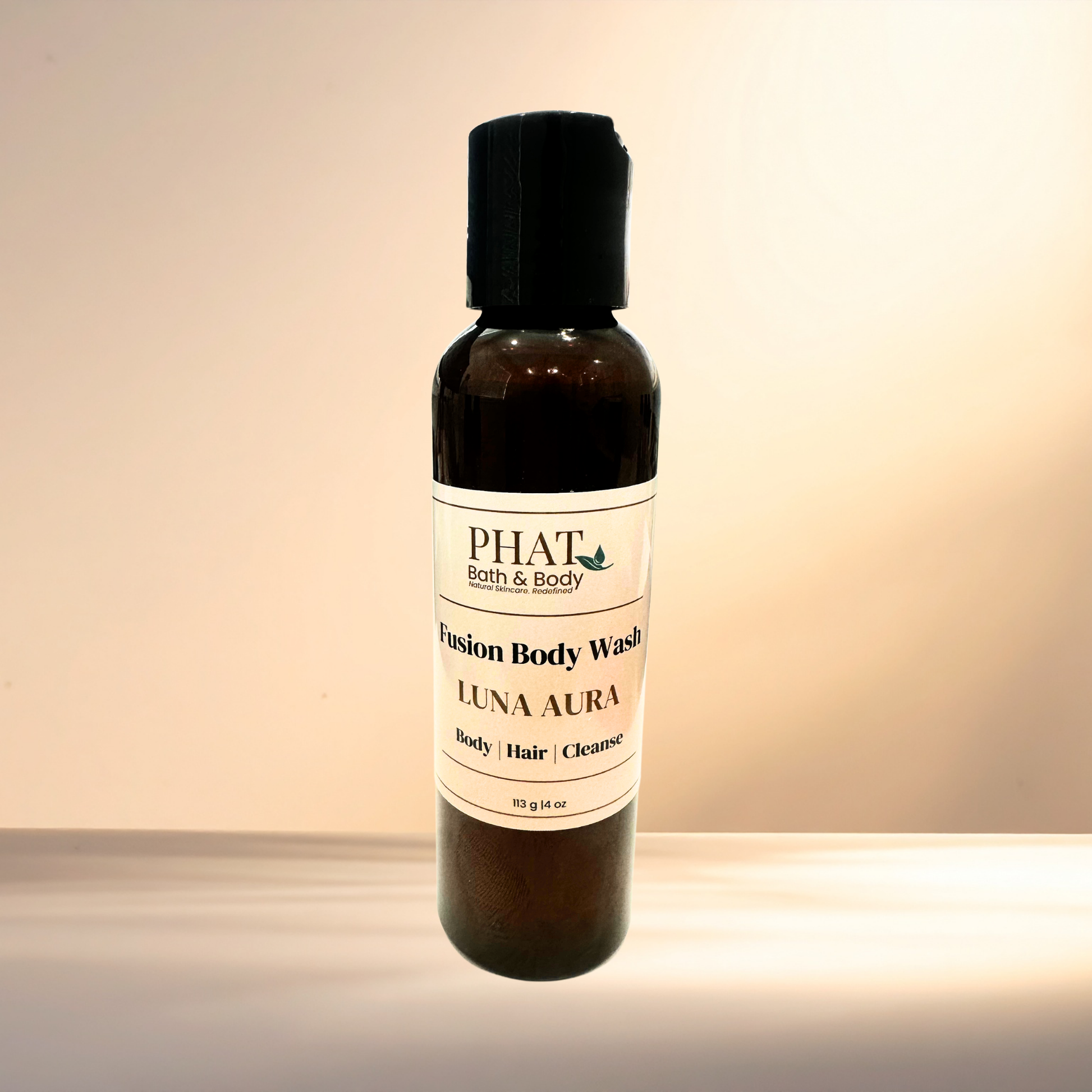 Bottle of Phat Bath & Body Fusion Body Wash Luna Aura on a gradient background