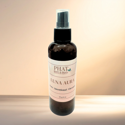 Bottle of PHAT Bath & Body Luna Aura product on a gradient background