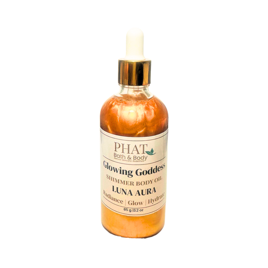 Bottle of Phat Bath & Body Glowing Goddess Shimmer Body Oil on a white background