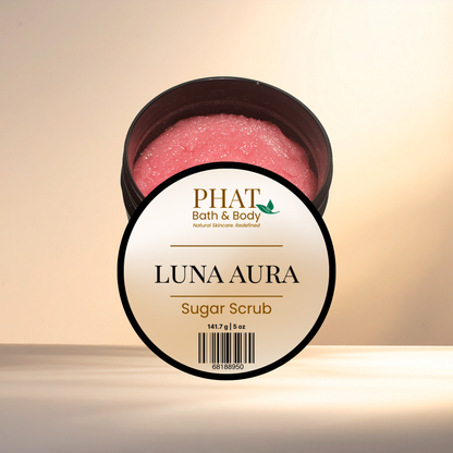 Jar of Luna Aura sugar scrub with 'Phat Bath & Body' label on a beige background