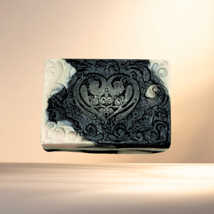 Decorative soap bar with intricate design on a beige background