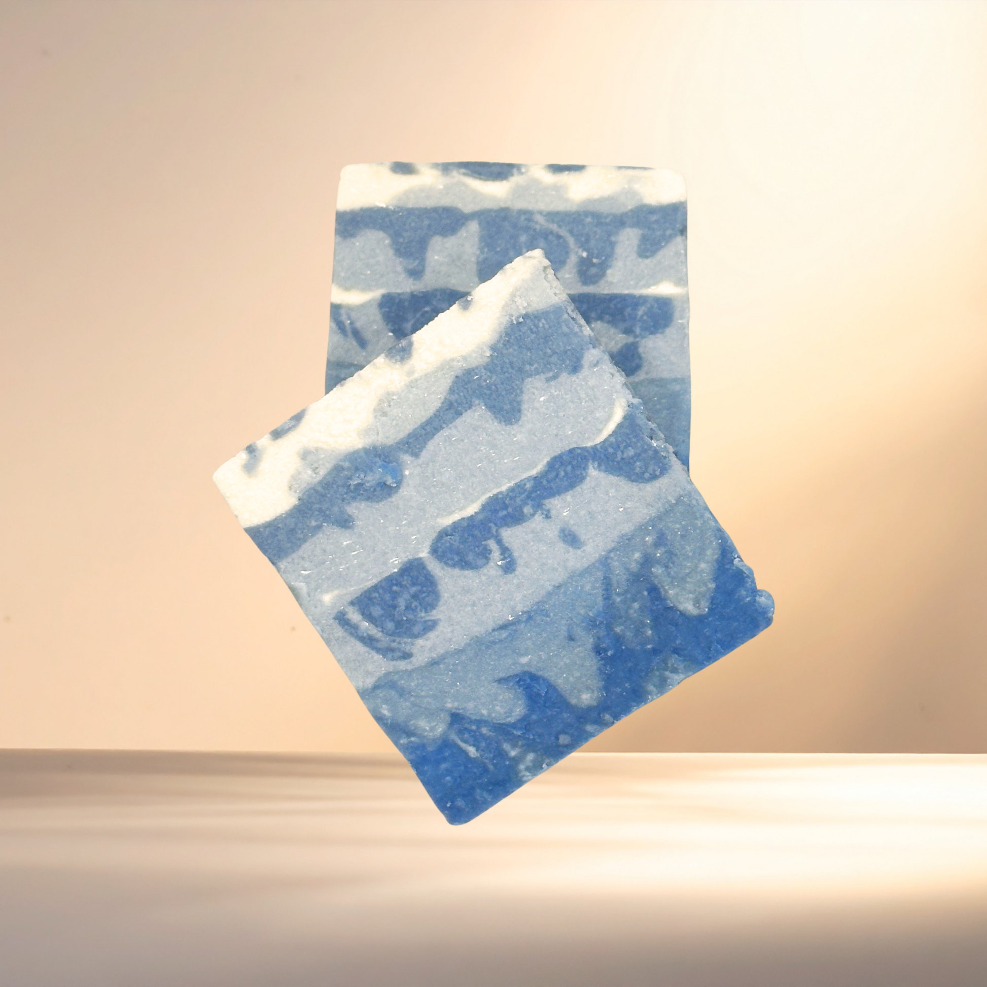 Blue and white patterned soap on a beige background