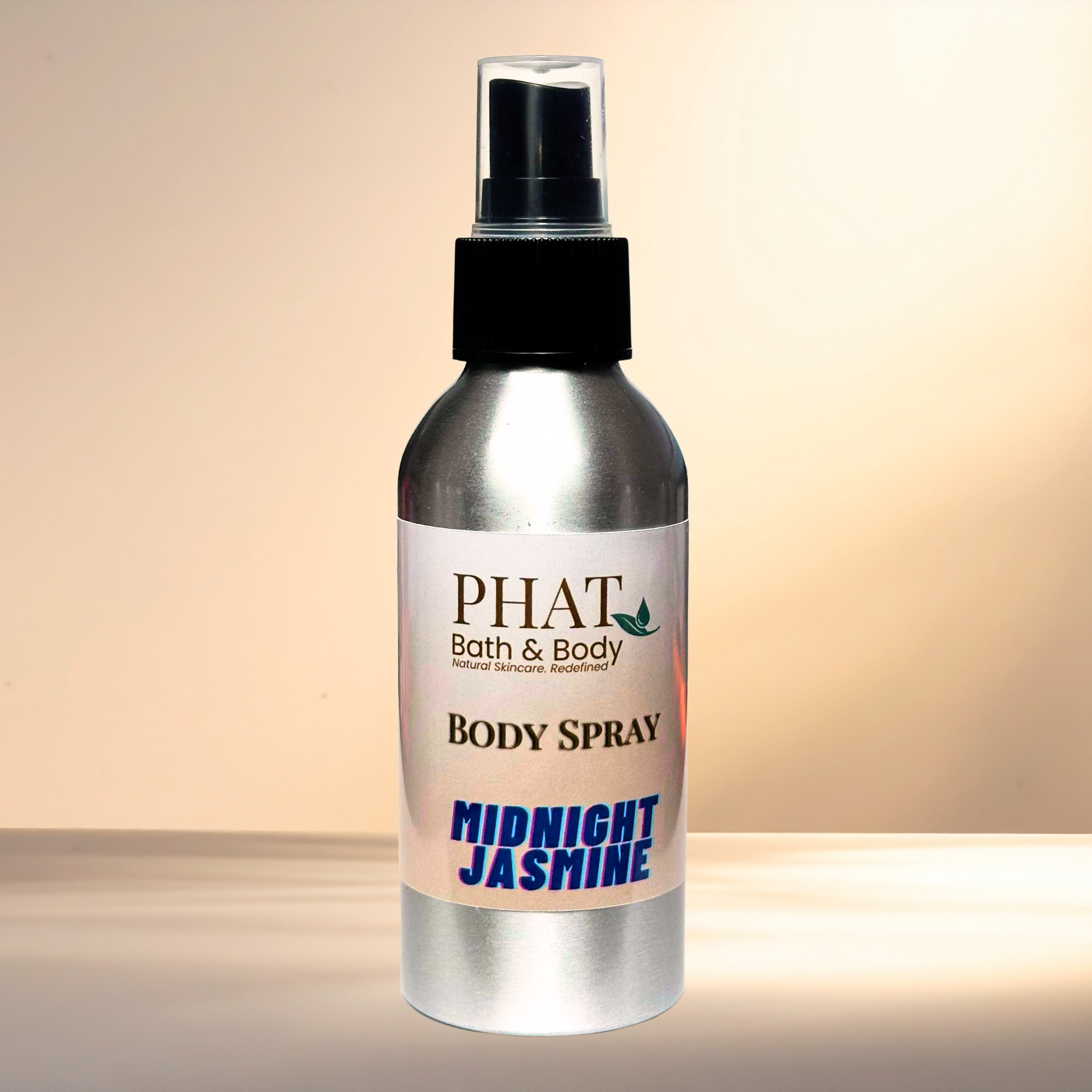 Body spray bottle labeled 'PHAT Bath & Body Midnight Jasmine' on a gradient background